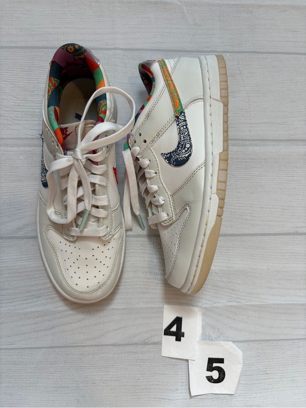 Nike Kids White Low-Top Sneakers with Multicolor Swoosh and Patterned Lining